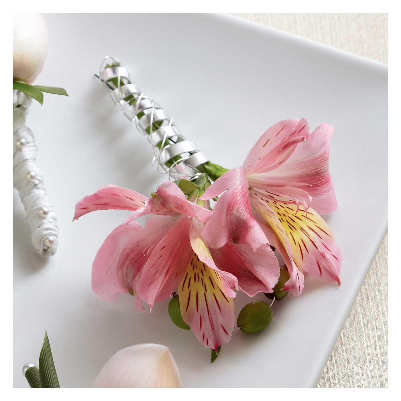 Pink Peruvian Lily Boutonniere flower arrangement
